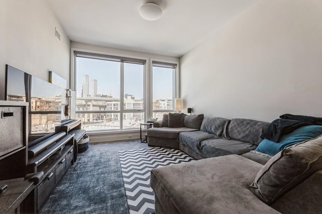 202 Merseles St Unit 504, Jersey City, NJ 07302 - living area featuring plenty of natural light and dark colored carpet