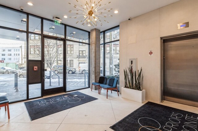 202 Merseles St Unit 504, Jersey City, NJ 07302 - building lobby featuring expansive windows and a security system