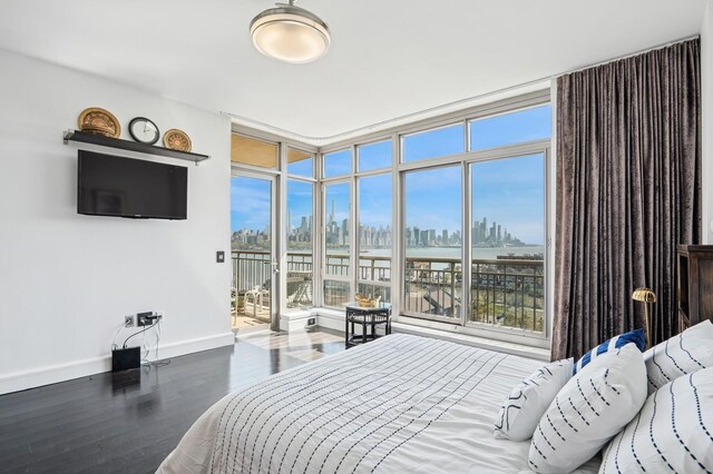 8100 River Rd Unit 1101, North Bergen, NJ 07047 - bedroom with wood finished floors, access to outside, and baseboards