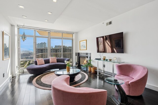 8100 River Rd Unit 1101, North Bergen, NJ 07047 - living room with floor to ceiling windows, visible vents, wood finished floors, and baseboards