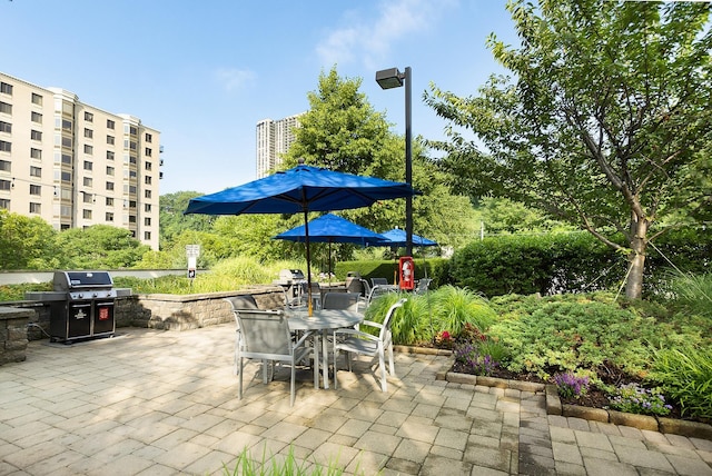 8100 River Rd Unit 1101, North Bergen, NJ 07047 - view of patio with grilling area and outdoor dining area