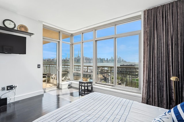 8100 River Rd Unit 1101, North Bergen, NJ 07047 - bedroom featuring baseboards, a water view, access to outside, a city view, and wood finished floors