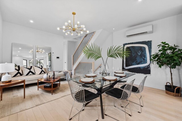 kitchen with white cabinetry, light stone counters, hanging light fixtures, appliances with stainless steel finishes, and decorative backsplash