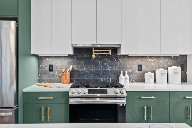 kitchen with green cabinetry, stainless steel appliances, white cabinetry, and light countertops