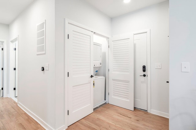 corridor featuring light hardwood / wood-style floors