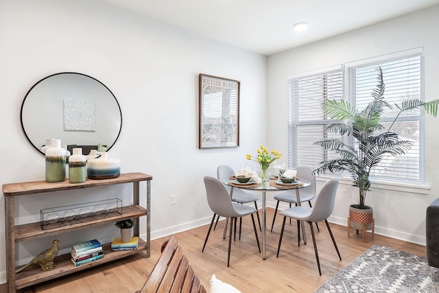 dining area with wood-type flooring