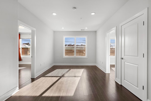 unfurnished room featuring dark hardwood / wood-style flooring