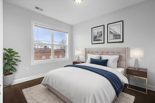 bedroom featuring dark hardwood / wood-style flooring