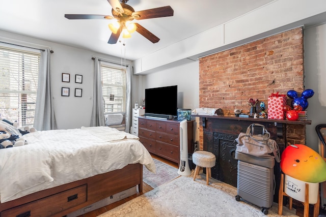bedroom featuring a ceiling fan and wood finished floors