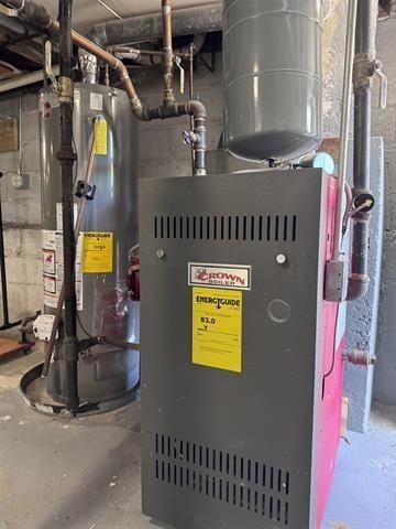 utility room featuring water heater