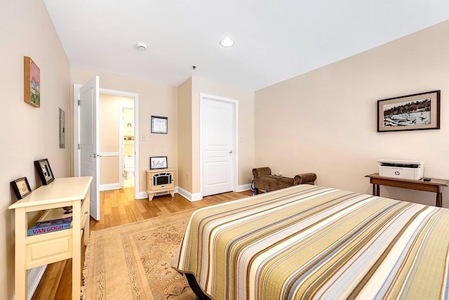 812 Grand St Unit 208, Hoboken, NJ 07030 - bedroom featuring light wood-style flooring, recessed lighting, and connected bathroom