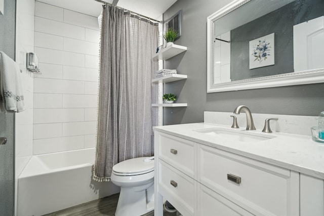 bathroom with shower / bathtub combination with curtain, vanity, toilet, and wood finished floors