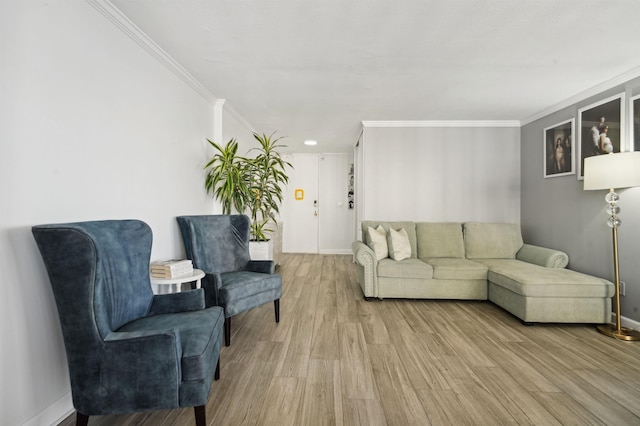 living room with crown molding, baseboards, and wood finished floors