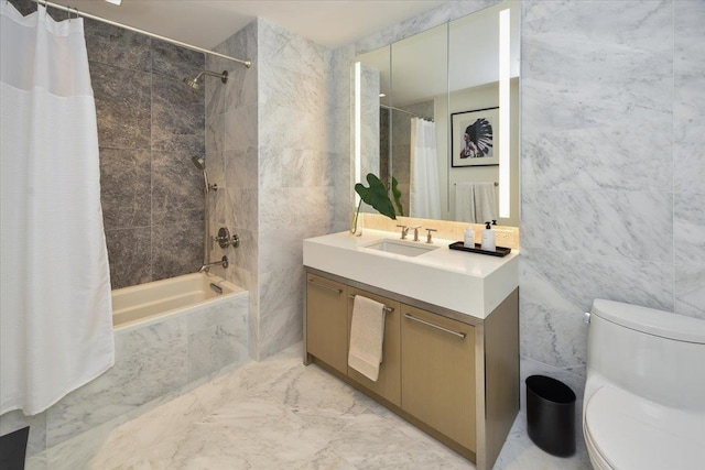 full bathroom with toilet, shower / tub combo, tile walls, and vanity