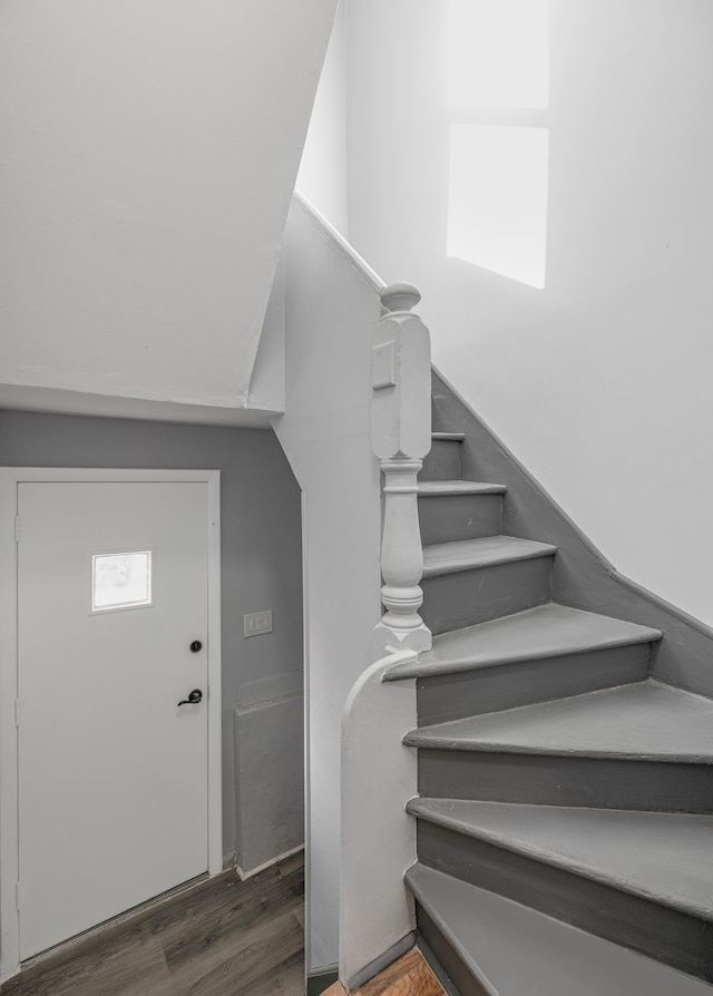 stairs with wood-type flooring