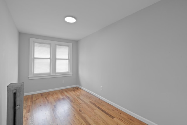 unfurnished room with light hardwood / wood-style flooring