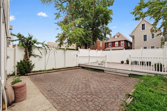 27 E 34th St, Bayonne, NJ 07002 - fenced backyard with a patio area and a wooden deck