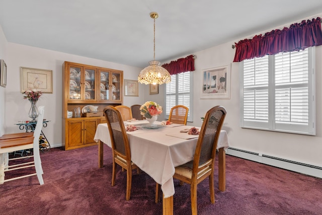27 E 34th St, Bayonne, NJ 07002 - dining room with dark carpet, a chandelier, and a baseboard radiator