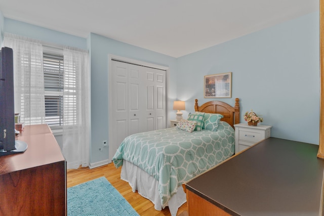 27 E 34th St, Bayonne, NJ 07002 - bedroom featuring light wood finished floors and a closet
