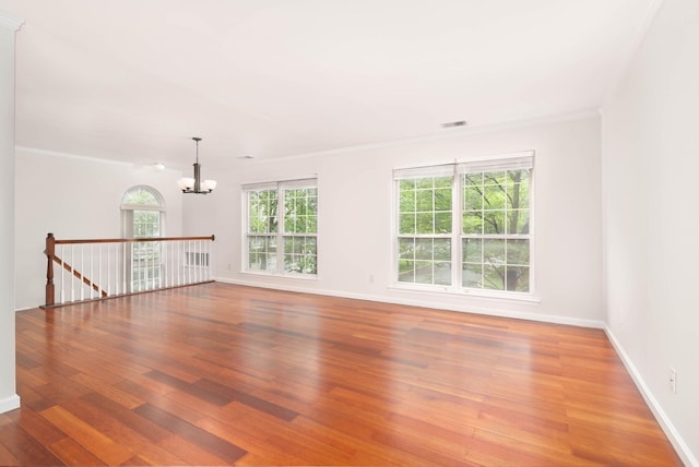 11 Crabapple Ct, Jersey City, NJ 07305 - unfurnished room featuring a chandelier, wood finished floors, and ornamental molding