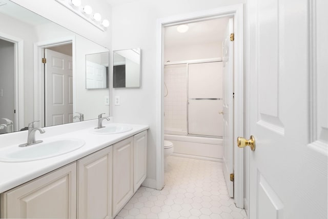 11 Crabapple Ct, Jersey City, NJ 07305 - bathroom with double vanity, bath / shower combo with glass door, and tile patterned flooring