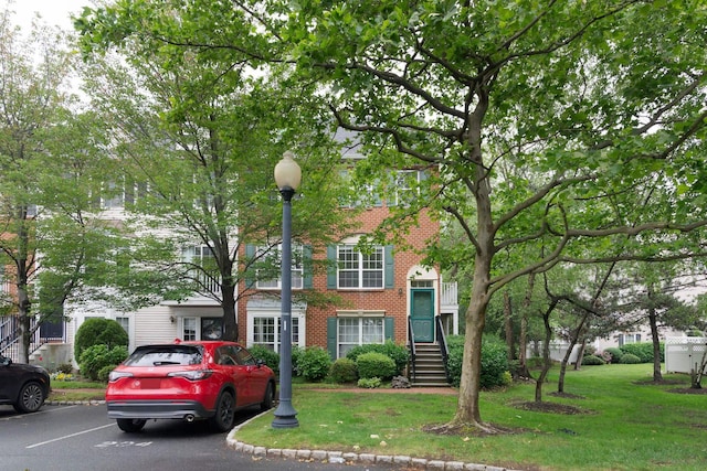 11 Crabapple Ct, Jersey City, NJ 07305 - view of property with brick siding and a front lawn