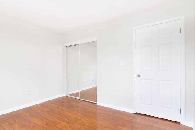 11 Crabapple Ct, Jersey City, NJ 07305 - unfurnished bedroom with wood finished floors and a closet
