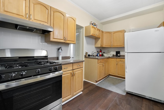 kitchen with freestanding refrigerator, under cabinet range hood, light brown cabinetry, and gas range