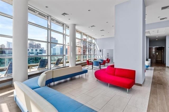 1 Shore Ln Unit 1805, Jersey City, NJ 07310 - building lobby with a view of city and floor to ceiling windows