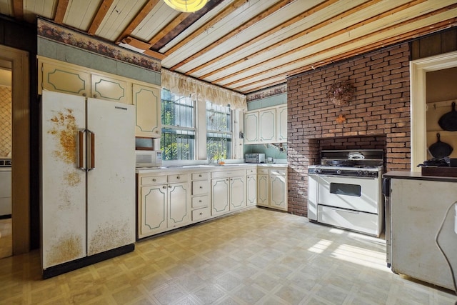 kitchen with white appliances and light floors