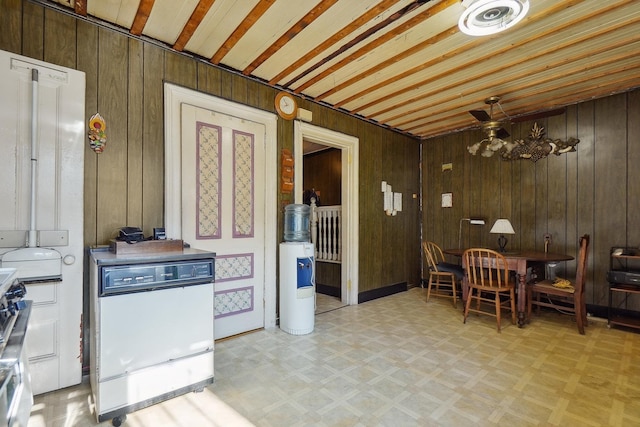 interior space featuring light floors and wooden walls