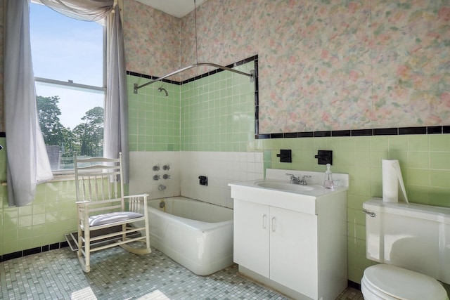 full bathroom featuring wallpapered walls, tile walls, and a wainscoted wall