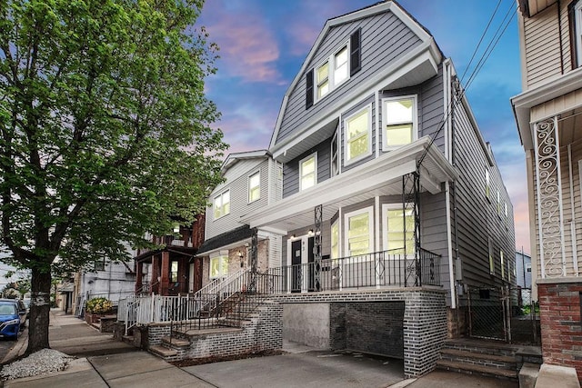 view of front of home featuring covered porch