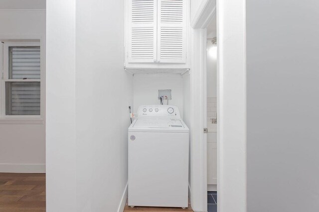 washroom featuring washer / dryer and baseboards
