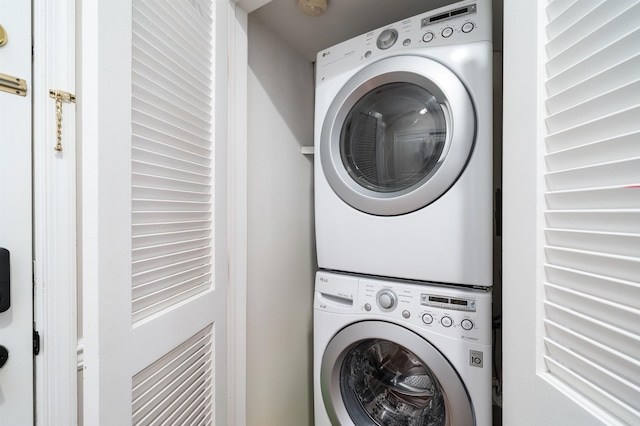 laundry room featuring laundry area and stacked washing maching and dryer