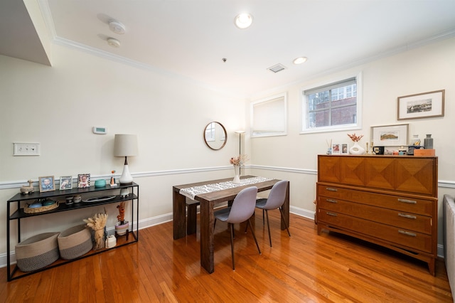 office area with wood finished floors, visible vents, baseboards, recessed lighting, and ornamental molding