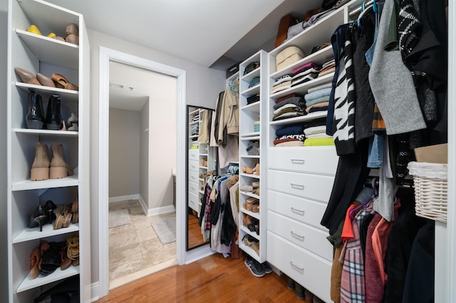 spacious closet featuring light wood-type flooring