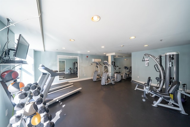 exercise room featuring recessed lighting and baseboards