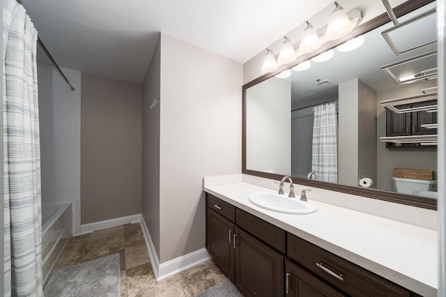 bathroom with visible vents, shower / bath combo with shower curtain, toilet, baseboards, and vanity