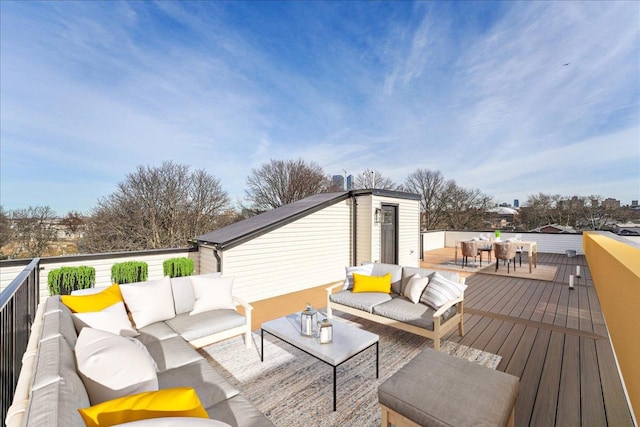 wooden terrace featuring outdoor lounge area