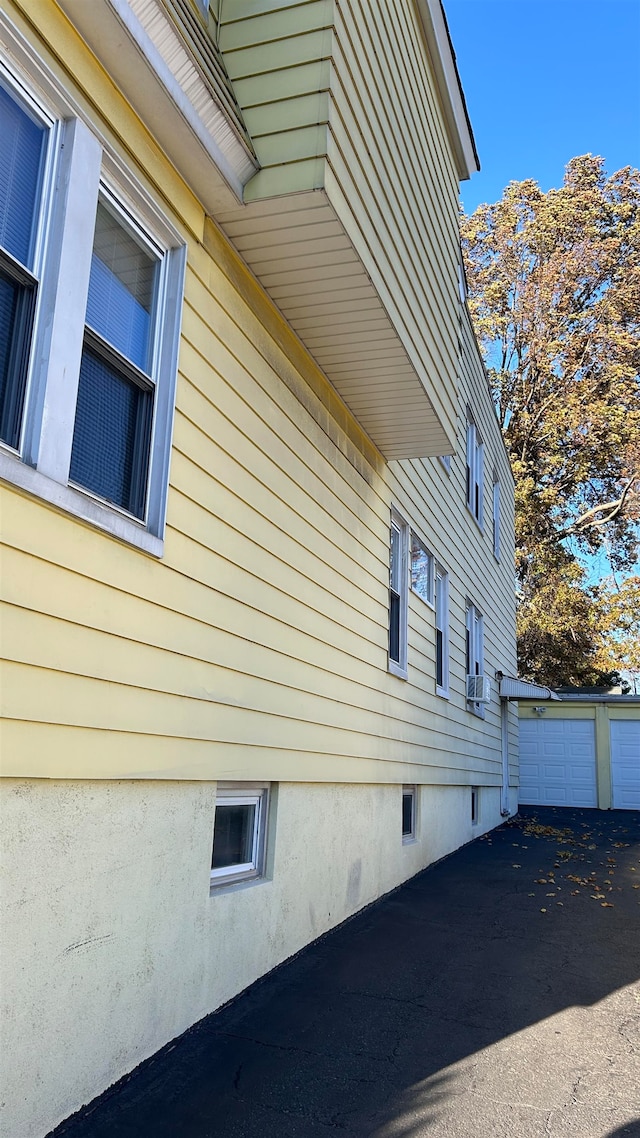 view of side of home with cooling unit