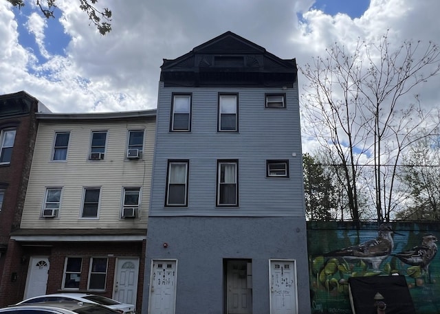 529 Communipaw Ave, Jersey City, NJ 07304 - view of front facade with cooling unit and stucco siding