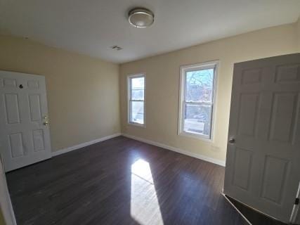 entrance foyer featuring dark hardwood / wood-style floors