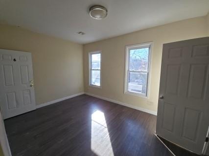 529 Communipaw Ave, Jersey City, NJ 07304 - entrance foyer with baseboards and dark wood finished floors