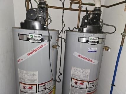 utility room featuring gas water heater