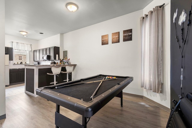 rec room with light wood finished floors, pool table, and baseboards