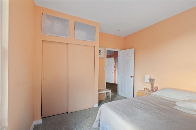 carpeted bedroom featuring a closet