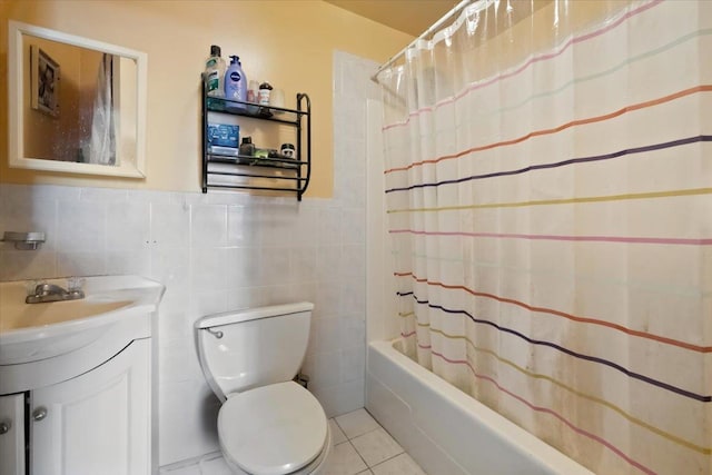 full bathroom featuring tile walls, tile patterned flooring, vanity, shower / tub combo, and toilet