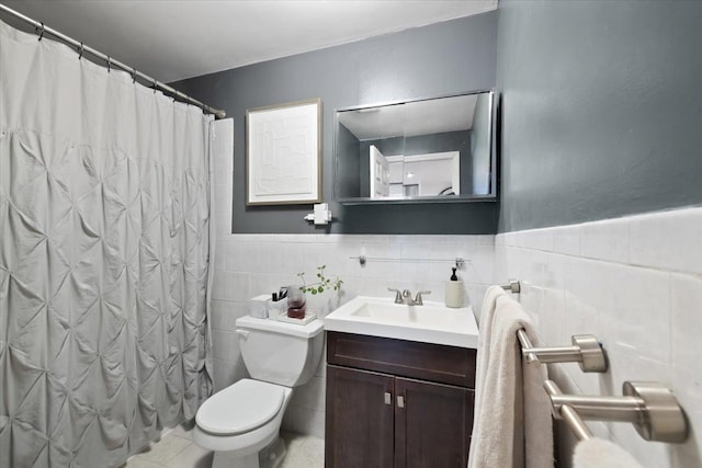 bathroom featuring tile walls, tile patterned flooring, vanity, toilet, and a shower with curtain