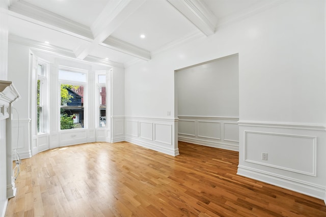 52 Brinkerhoff St, Jersey City, NJ 07304 - spare room with beamed ceiling, wood finished floors, wainscoting, a decorative wall, and crown molding